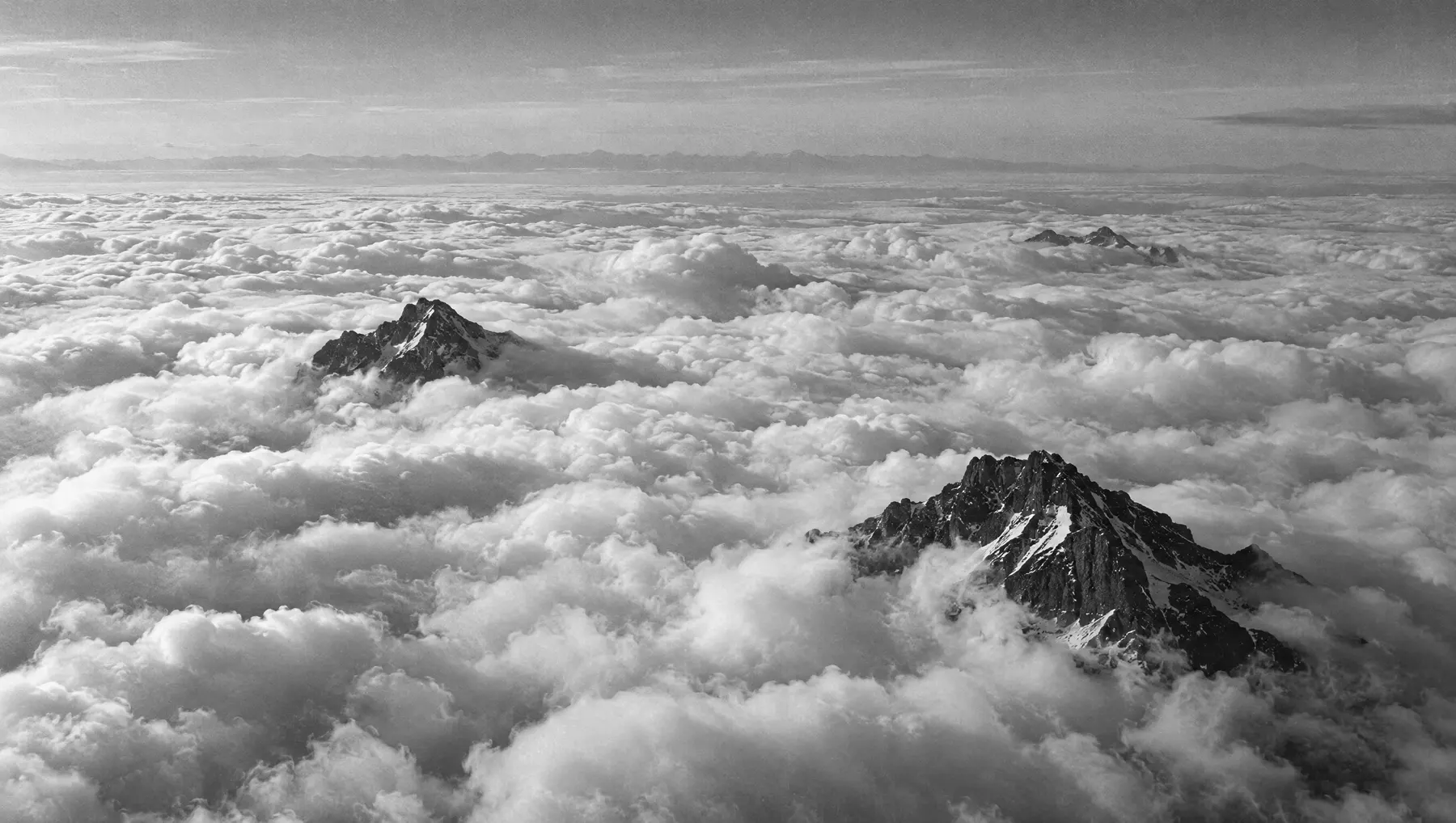 Clouds and dark mountain peaks.